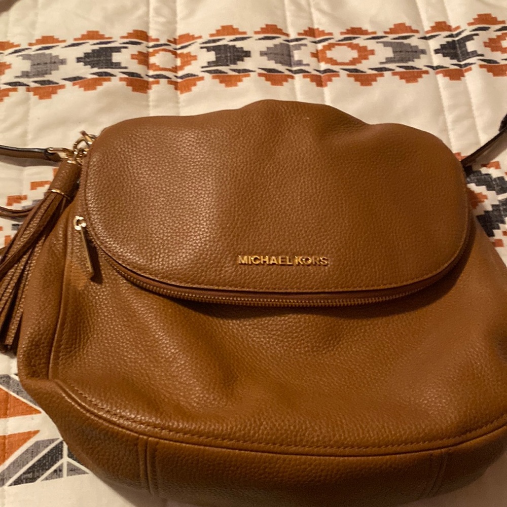 Michael Kors bag, it is crossed or brown shoulder in good condition.